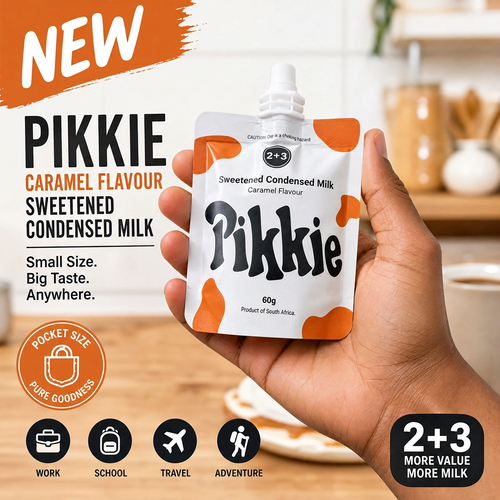 A hand holding a pouch of Pikkie Caramel Flavour Sweetened Condensed Milk, with promotional text and icons on a kitchen background.